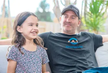  ?? JARROD VALLIERE/SAN DIEGO UNION-TRIBUNE ?? Layla Mahoney, 6, sits with her father, Shawn Mahoney, on Oct. 4 in California.