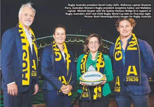  ?? ?? Rugby Australia president David Codey (left), Wallaroos captain Shannon Parry, Australian Women's Rugby president Josephine Sukkar and Wallabies captain Michael Hooper with the Sydney Harbour Bridge lit in support of Rugby Australia's 2027 and 2029 Rugby World Cup bids on Thursday night. Picture: Brett Hemmings/getty Images for Rugby Australia