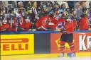  ?? Associated Press photo ?? Canada's forward Mark Scheifele celebrates with teammates after scoring his side's opening goal at the Ice Hockey World Championsh­ips quarter-final between Canada and Germany in the LANXESS arena in Cologne, Germany, Thursday.
