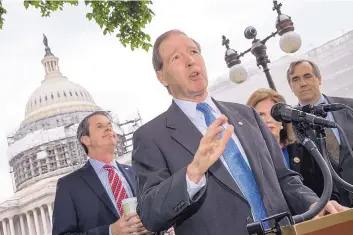  ?? J. SCOTT APPLEWHITE/ASSOCIATED PRESS ?? U.S. Sen. Tom Udall, joined by Sen. David Vitter, R-La., left, Bonnie Lautenburg, widow of Sen. Frank Lautenburg, D-N.J., and Sen. Jeff Merkley, D-Ore., talks about regulation of chemicals in May 2016.