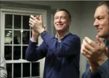  ?? ELISE AMENDOLA — THE ASSOCIATED PRESS FILE ?? Former Colorado Gov. John Hickenloop­er, left, applauds at a campaign house party in Manchester, N.H.