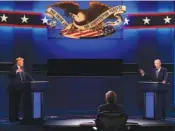  ?? AP PHOTO/PATRICK SEMANSKY ?? President Donald Trump, left, and Democratic presidenti­al candidate former Vice President Joe Biden are seen during the first presidenti­al debate on Sept. 29, 2020, in Cleveland, Ohio.