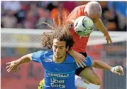  ?? (AFP) ?? Lorient’s Fabien Lemoine (R) and Marseille’s Matteo Guendouzi battle for the ball duing their Ligue 1 match on Sunday