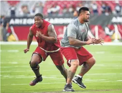  ?? MICHAEL CHOW/THE REPUBLIC ?? Cardinals offensive tackle D.J. Humphries (left) and offensive guard Mike Iupati are are healthy entering training camp.