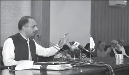  ?? -APP ?? Federal Minister for Power Omar Ayub Khan addressing a press conference at PID Media Centre.