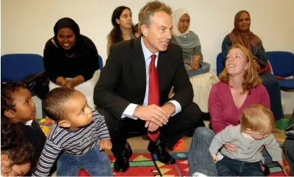  ?? Photograph: John Stillwell/PA ?? ‘Funding for Sure Start has been cut by two-thirds.’ Tony Blair visiting a Sure Start children’s centre in London in 2006.