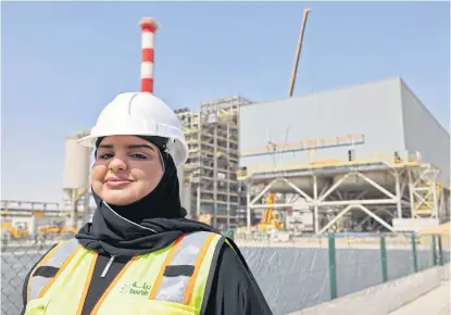  ?? AFP ?? Engineer Nouf Wazir is pictured in front of Bee’ah’s waste management facility under constructi­on in the Gulf emirate of Sharjah.