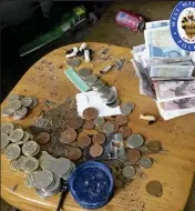  ??  ?? Haul: Cash and drugs in ‘filthy’ home