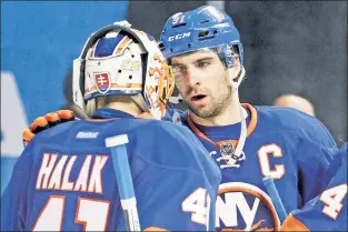  ?? Paul J. Bereswill ?? IS IT ENOUGH? The Islanders, who begin their season Friday against the Blue Jackets, believe they have a better group around captain John Tavares (right), who saw his team miss the playoffs by one point last season.