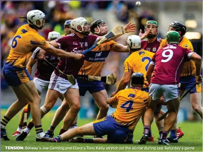  ??  ?? TENSION: Galway’s Joe Canning and Clare’s Tony Kelly stretch for the sliotar during last Saturday’s game