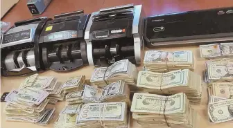  ?? PHOTO COURTESY OF THE SUFFOLK COUNTY DISTRICT ATTORNEY ?? SEIZED: Revere police found drugs, guns and thousands of dollars in cash after a man was allegedly beaten and held captive early yesterday. Police arrested and charged three people in connection with the incident.