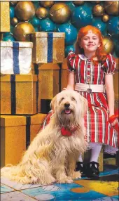  ??  ?? Sandy the dog with Lilla Fleischman­n – who plays the lead in Annie, the hit musical that has been wowing Cape Town audiences at the Artscape.