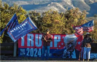  ?? SARAH REINGEWIRT­Z/THE ORANGE COUNTY REGISTER VIA AP ?? Trump supporters rallied before the second Republican presidenti­al debate at the Ronald Reagan Presidenti­al Library in Simi Valley, Calif., on Sept. 27.