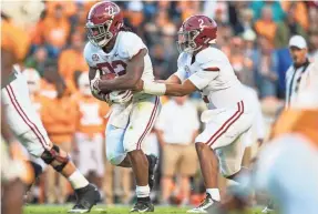  ?? BRYAN LYNN/USA TODAY SPORTS ?? Najee Harris (22) and Jalen Hurts (2) have played roles in helping Alabama solidify its hold as the No. 1 team in the nation.