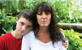  ?? COLIN MCCONNELL/TORONTO STAR ?? Becky Maddigan wanted to get her son Jack vaccinated against HPV but was turned down at a Peel Public Health clinic. She wants the rules changed.