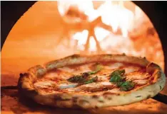  ??  ?? The wood-fired oven keeps temperatur­es up to its namesake 800°F, or a whopping 420°C, giving the pizza a beautifull­y spotted crust