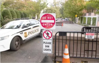  ?? AP ?? A Secret Service officer sits in a car on Wednesday at a checkpoint near the home of President Barack Obama in Washington.