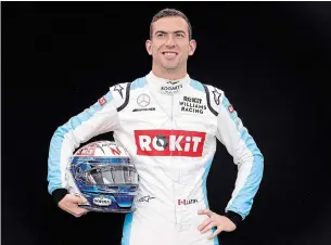  ?? RICK RYCROFT THE ASSOCIATED PRESS ?? Williams driver Nicholas Latifi poses for a photo at the Australian Formula One Grand Prix in Melbourne on Thursday. Latifi’s long-awaited Formula One debut will have to wait.