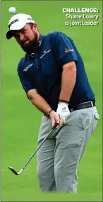  ??  ?? CHALLENGE: Shane Lowry is joint leader