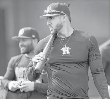  ?? Karen Warren / Houston Chronicle ?? George Springer, who hopes to pick up tips from veteran outfielder Carlos Beltran this season, carries his bat to work to join the rest of the early-to-camp position players Thursday in West Palm Beach, Fla.