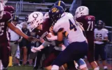  ?? BILL RUDICK — FOR DIGITAL FIRST MEDIA ?? Unionville’s Alex Pelegrin stops Oxford’s Bret Kochmansky during Unionville’s win over Oxford Friday.