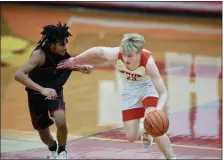  ?? NOELLE WITHERITE — FOR THE NEWS-HERALD ?? Mentor’s Matthew Bidell dribbles upcourt against Chaney on Feb. 4.