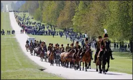  ??  ?? The King's Troop Royal Horse Artillery arrive at Windsor Castle in preparatio­n for the Gun Salute on the palace grounds