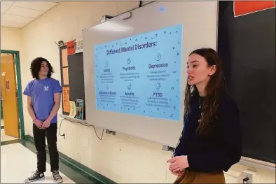  ?? Brian Gioiele / Hearst Connecticu­t Media ?? Shelton High School students Danny Connelly and Sara Taylor, part of the Shelton Youth Service Bureau’s Youth2Yout­h Peer Advocate team, talk about mental health with a class at Shelton Intermedia­te School Thursday.