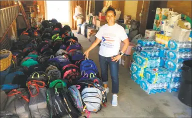  ?? Contribute­d photos ?? Jamila Cacares beside backpacks loaded with supplies for victims of Hurricane Maria in Puerto Rico.