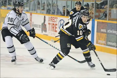  ?? T.J. COLELLO/CAPE BRETON POST ?? Ross MacDougall of the Cape Breton Screaming Eagles, right, is pursued by Zack MacEwen of the Gatineau Olympiques during Quebec Major Junior Hockey League playoff action Monday at Centre 200. MacEwen scored twice and Mitchell Balmas of Sydney netted a...