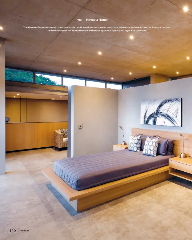  ??  ?? The theme of openness and transparen­cy is continued into the master bedroom, where a low-level screen wall wraps around
the bed to create an intimate nook within the spacious open-plan layout of the room.