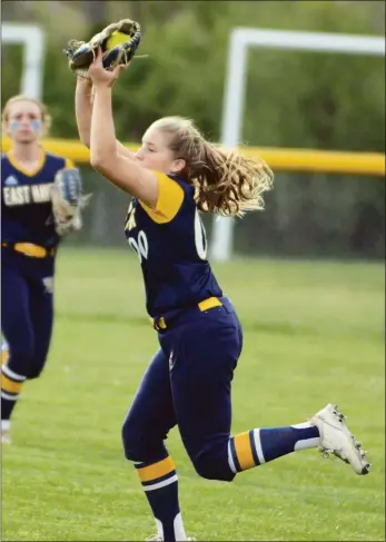  ?? Dave Phillips / For Hearst Connecticu­t Media ?? East Haven rightfield­er Gianna Santoro makes a running catch.