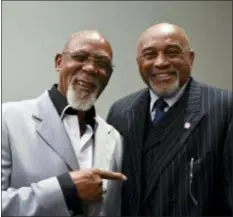  ?? SAIT SERKAN GURBUZ — THE ASSOCIATED PRESS FILE ?? U.S. track Olympians John Carlos, left, and Tommie Smith pose for a portrait at Georgetown University.