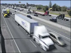  ?? AP ?? The federal government wants to limit how fast trucks can drive on the nation’s highways. A new regulation would impose the nationwide limit by electronic­ally capping speeds with a device on newly made U.S. vehicles that weigh more than 26,000 pounds.