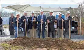  ??  ?? / Kevin Myrick Reliable Heath Care Management officials joined with officials from the City of Rockmart to celebrate the groundbrea­king of The Cottages at Rockmart on Goodyear Avenue.