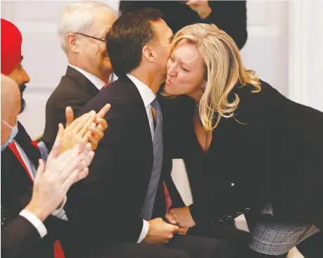  ?? BLAIR GABLE/REUTERS ?? Bill Morneau embraces Mona Fortier during the unveiling of Prime Minister Justin Trudeau’s cabinet in Ottawa on Wednesday. Kevin Carmichael says there’s a problem with the cabinet being overpopula­ted with thinkers and dreamers instead of those with experience.