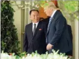  ?? THE ASSOCIATED PRESS ?? President Donald Trump talks with Kim Yong Chol, former North Korean military intelligen­ce chief and one of leader Kim Jong Un’s closest aides, as they walk from the Oval Office at the White House in Washington on Friday.