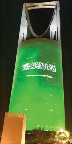  ??  ?? Government buildings, streets and bridges have been decorated with green flags and lights to mark the Saudi National Day.