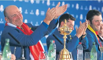  ?? Picture: PA. ?? Thomas Bjorn leads the applause at Team Europe’s press conference.