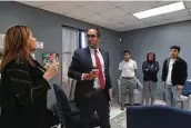  ?? Billy Calzada / Staff photograph­er ?? Talli Dolge of Jewish Family Service, left, talks to former U.S. Rep. Will Hurd about the San Antonio Mobile Mental Wellness Partnershi­p at Athens Elementary School last year.