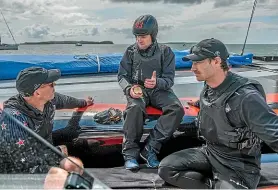  ??  ?? Ray Davies, Glenn Ashby and Louis Sinclair discuss progress during a break in Team New Zealand testing of their AC75 in Auckland.