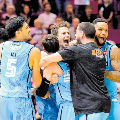  ?? Photo / Getty Images ?? Tom Abercrombi­e celebrates his last-second matchwinne­r with the Breakers in Brisbane.