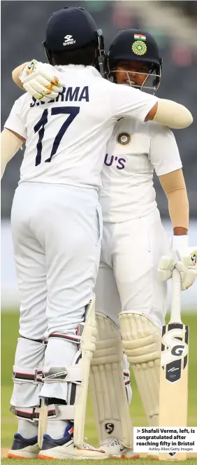  ?? Ashley Allen/Getty Images ?? Shafali Verma, left, is congratula­ted after reaching fifty in Bristol