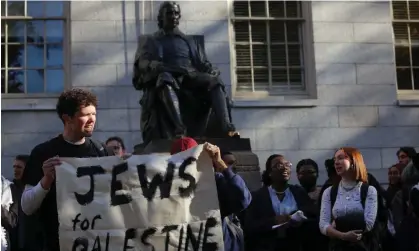  ?? Photograph: Brian Snyder/Reuters ?? Demonstrat­ors gather under the statue of John Harvard at Harvard University in Cambridge, Massachuse­tts, on 16 November 2023.