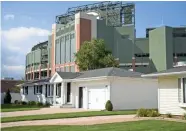  ?? RICHARD RYMAN / USA TODAY NETWORK-WISCONSIN ?? Houses on Stadium Drive in Ashwaubeno­n have a good view of Lambeau Field in addition to being adjacent to Packers property. That increases the value of that property.