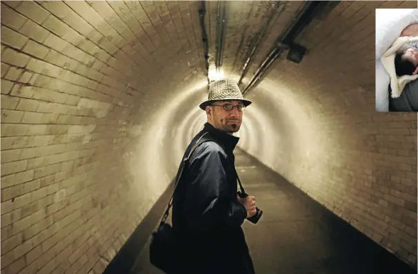  ??  ?? Above: photograph­er Thys Dullaart took this picture of Anton Hammerl in the Greenwich foot tunnel under the Thames in London in 2009. Inset right, Hammerl with his last-born child, Hiro, in London in February 2011. Hammerl left for Libya a few weeks later, on March 28.