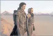  ?? WARNER BROS. PICTURES ?? Timothee Chalamet, left, and Rebecca Ferguson in “Dune,” which earned another $15.5 million this weekend.