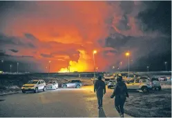  ?? MARCO DI MARCO/THE ASSOCIATED PRESS ?? Plumes of smoke rise from volcanic activity between Hagafell and Stóri-Skógfell, Iceland, on Saturday. The eruption on the Reykjanes Peninsula began Saturday night, according to the Icelandic Meteorolog­ical Office, and it quickly formed a 1.8-mile-long fissure in the ground, the office said.