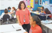  ?? GREG SORBER/JOURNAL ?? Hope Montoya-Encinias teaches a financial literacy course for high school students at Bernalillo High School on Monday. Nusenda Credit Union is offering the free summer course for high school credit.