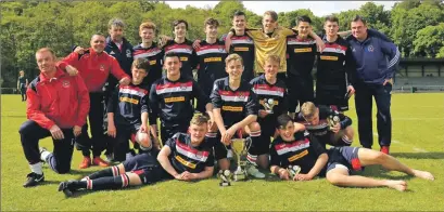  ??  ?? Oban Saints Under 17s with their coaches after winning the DFDL League Cup. Photograph­s: Kenny Gray.